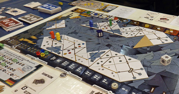 Photo of Summit in play, showing the routes established up the mountain and players pawns