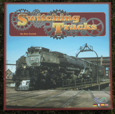 The cover of Switching Tracks: a locomotive on a turntable