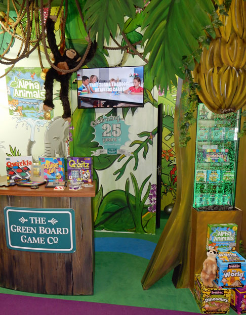 Photo of The Green Board Game Company's stand at the Toy Fair for their 25th anniversary - Brainbox in the jungle
