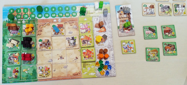 My player board (gren) during Keyper, with my stored animals and resources plus my building tiles