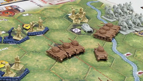 Early in the Memoir '44 Overlord game - Russian tanks - supported by cavalry! - attack on their right flank