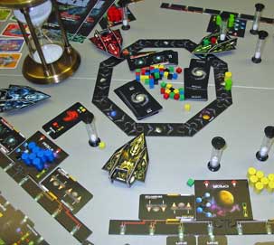 Space Dealer in play showing the cards, sapceships and sandtimers