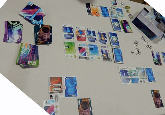 Playing Xenon Profiteer - available cards in the middle with lots of air to the left