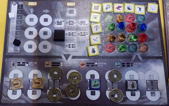 My player board showing the actions I've programmed with my coins and tiles